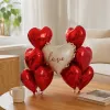 Romantic red heart-shaped balloons with the word "love" in white are combined for wedding party decoration, atmosphere arrangement, and gift giveaways details Picture
